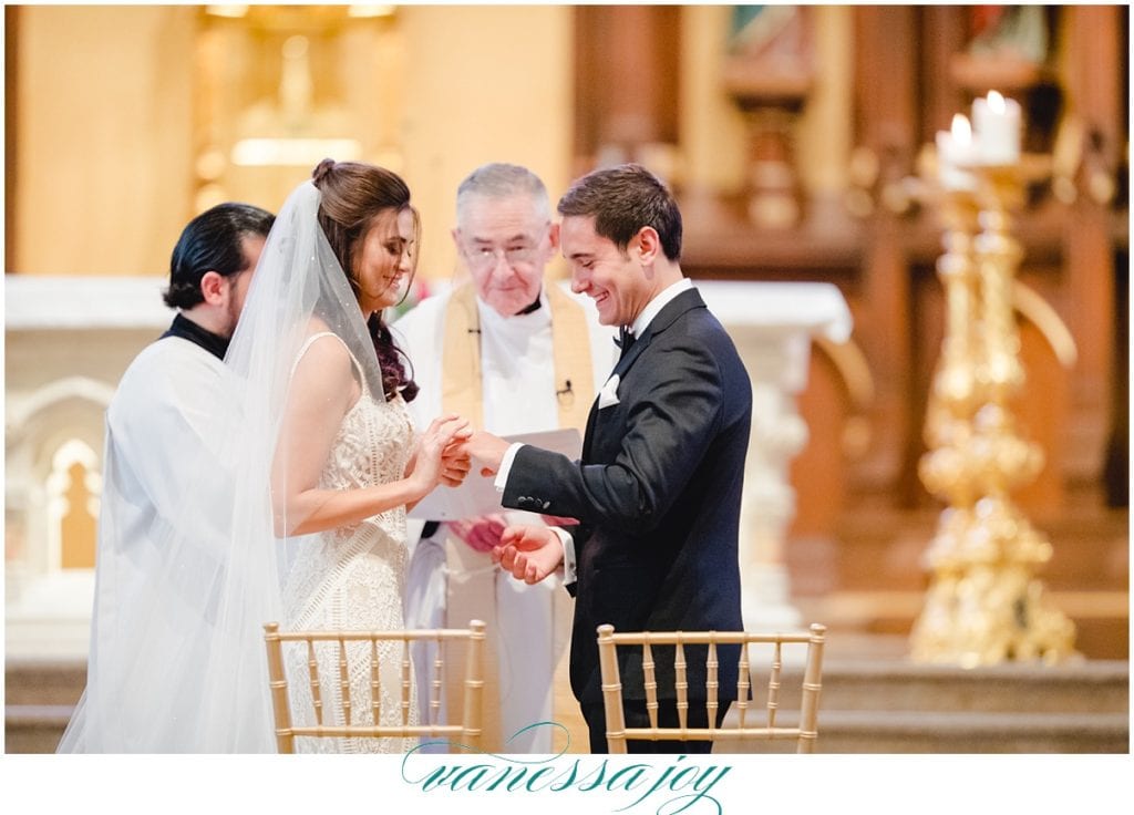 bride and groom exchanging rings in Saint Patrick's Old Cathedral