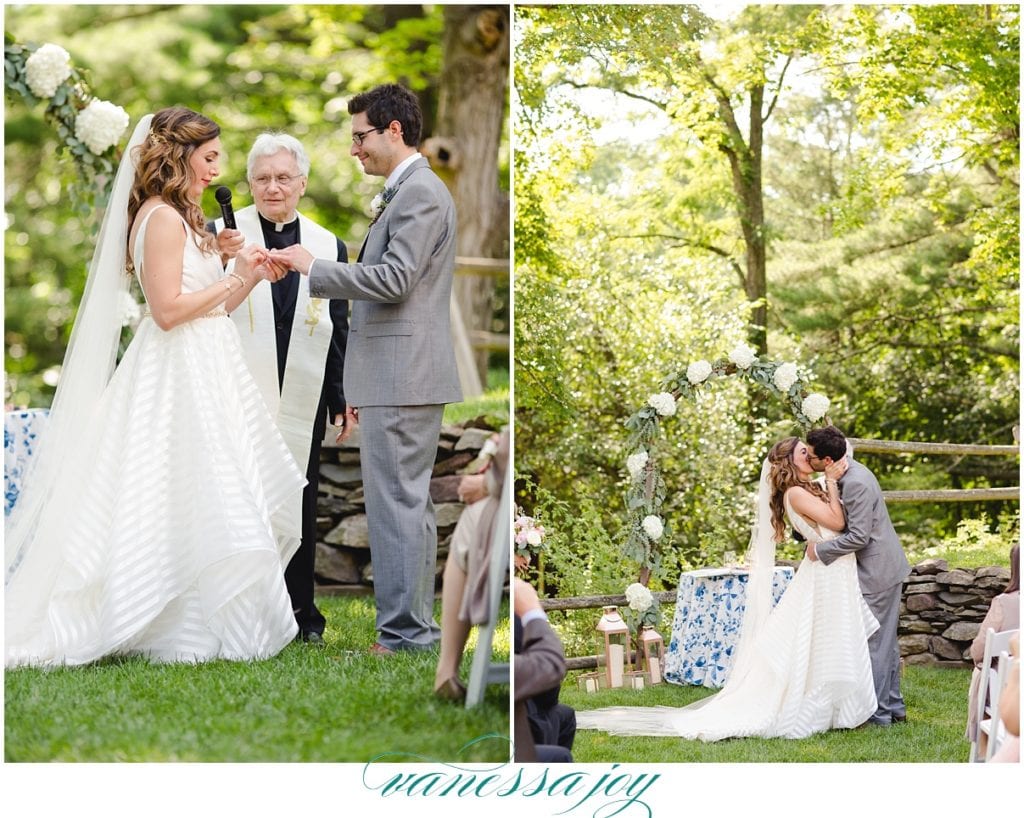 bride and grooms first kiss as husband and wife