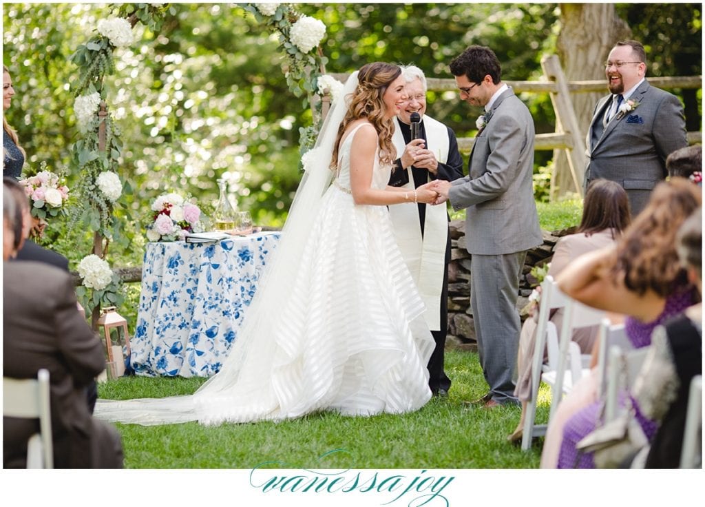 bride and groom at the altar at the inn at millrace pond