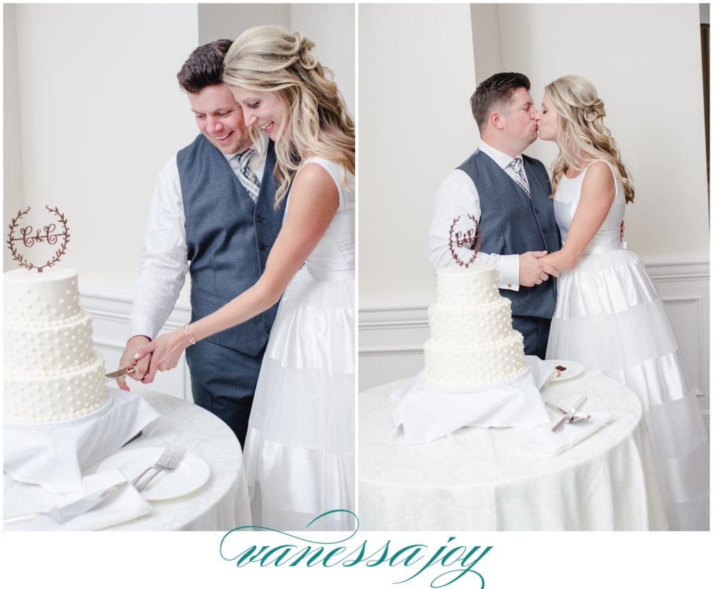 bride and groom cut their cake