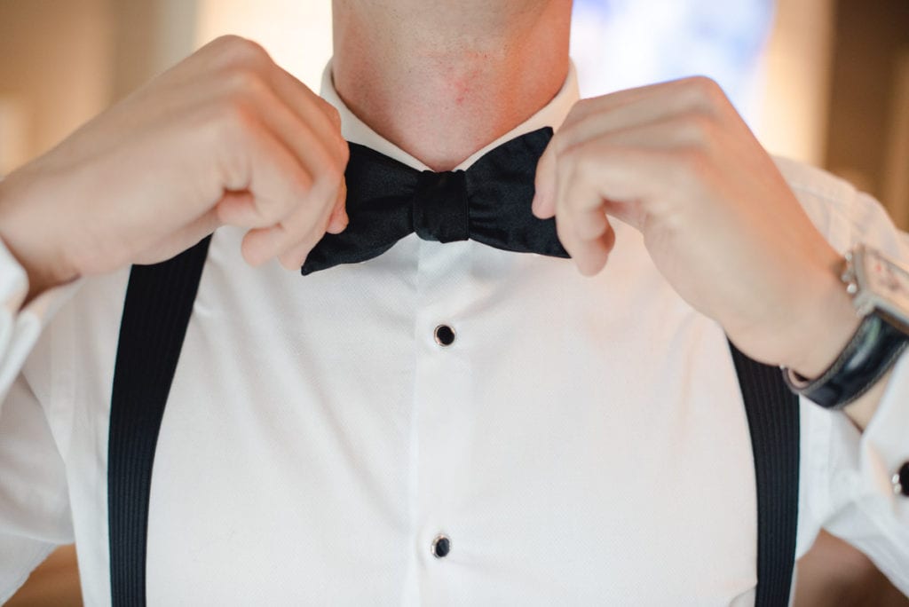 bow tie and suspenders, groom getting ready 