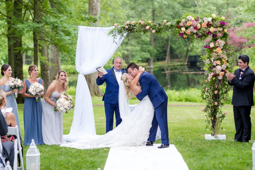 first kiss as husband and wife, wedding photography