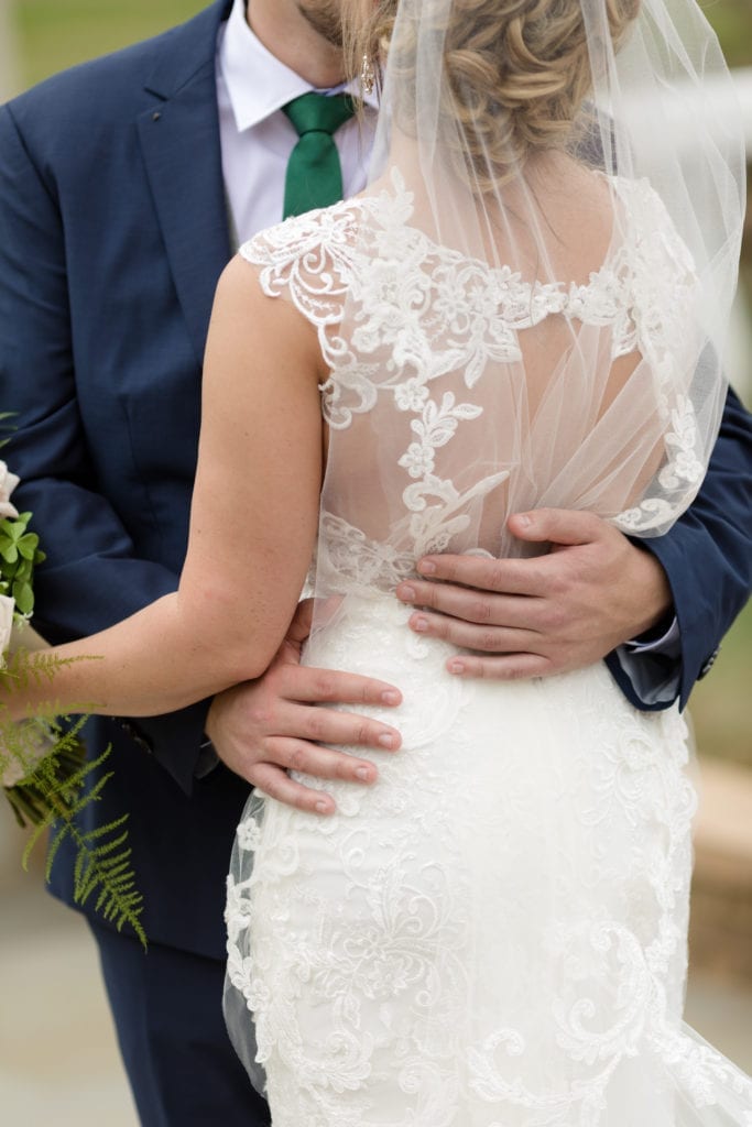 bride and groom embrace