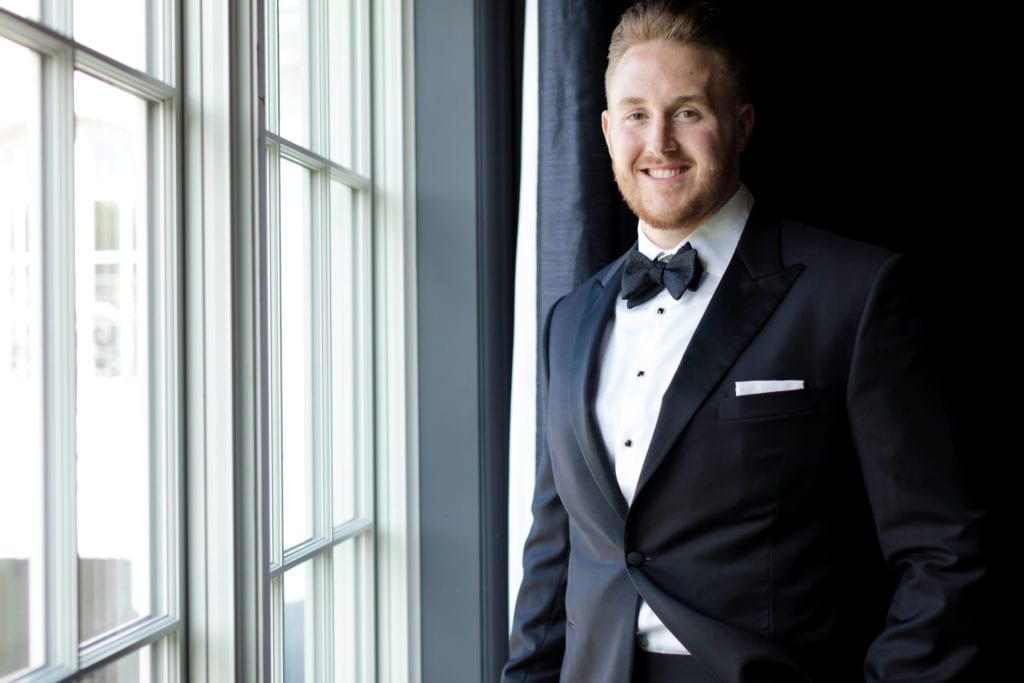 groom smiling for the camera