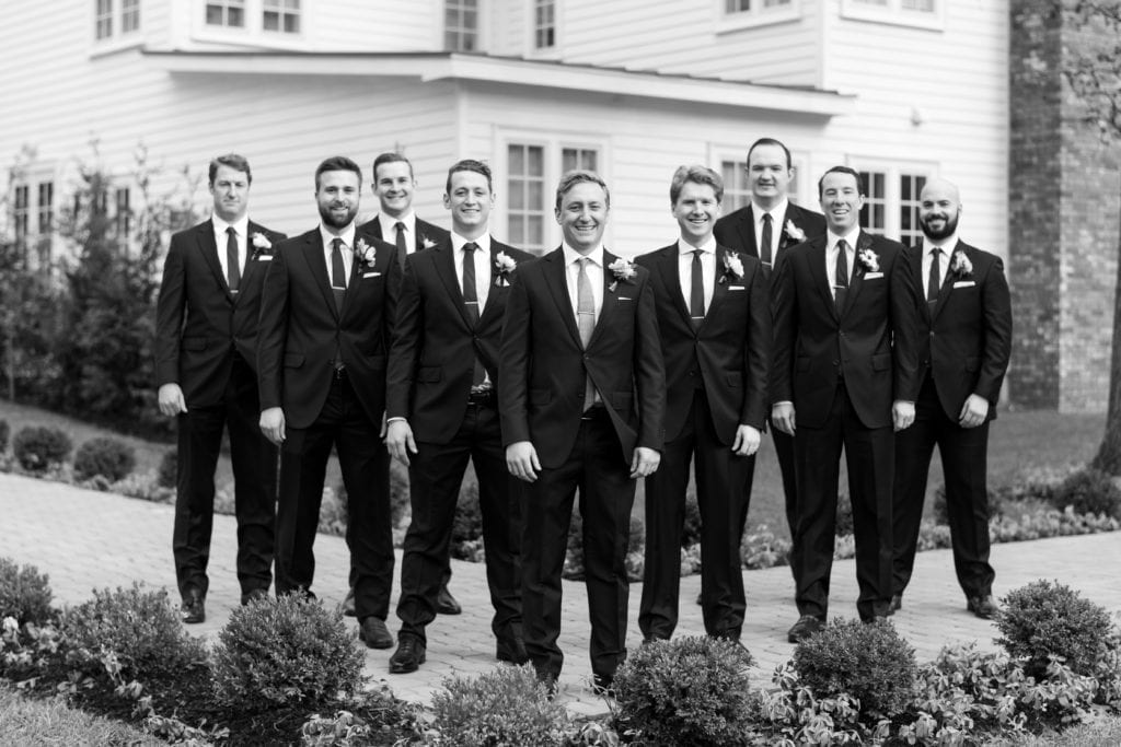 black and white shot of groom and his groomsmen