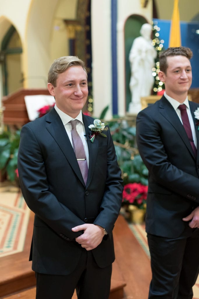 groom tearing up as his bride walks down the aisle