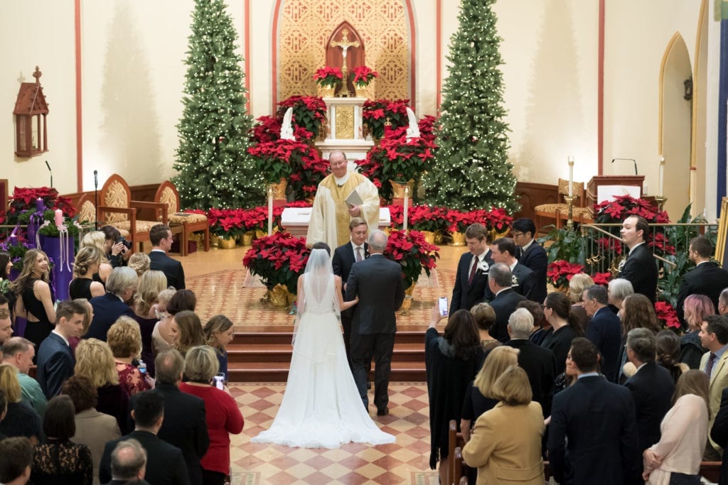 father of the bride giving his daughter away