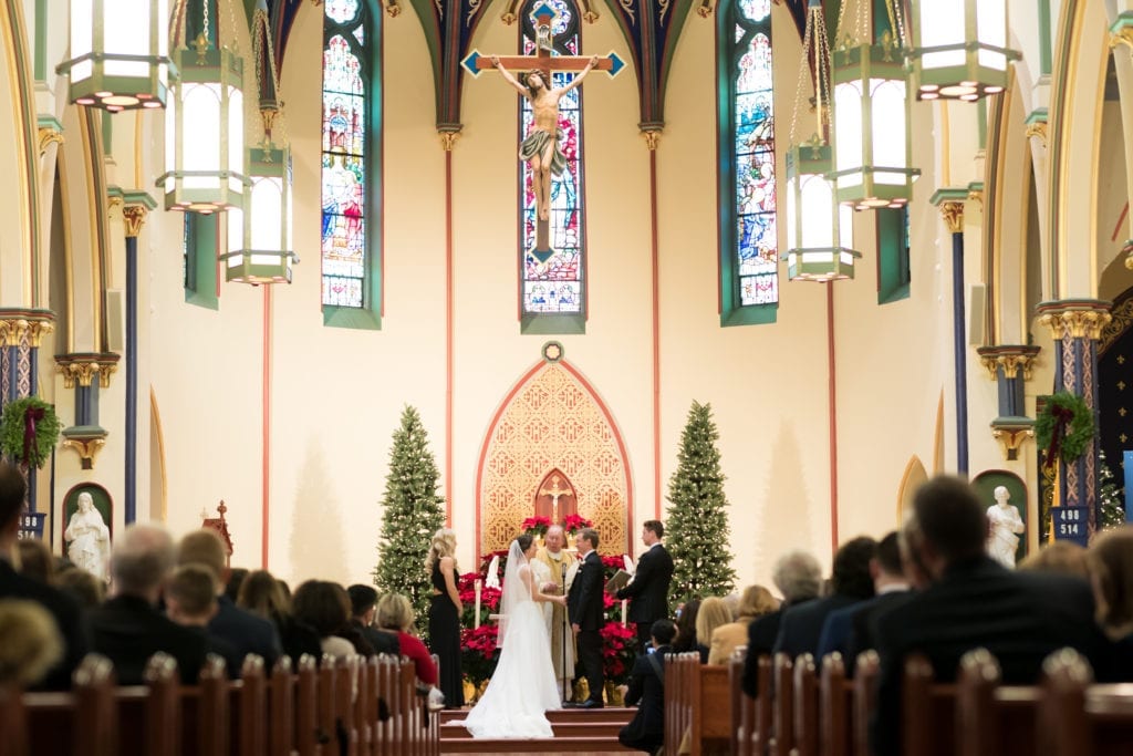 bride and groom reading their vows to each other