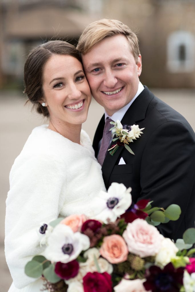 bride and groom sharing smiles 