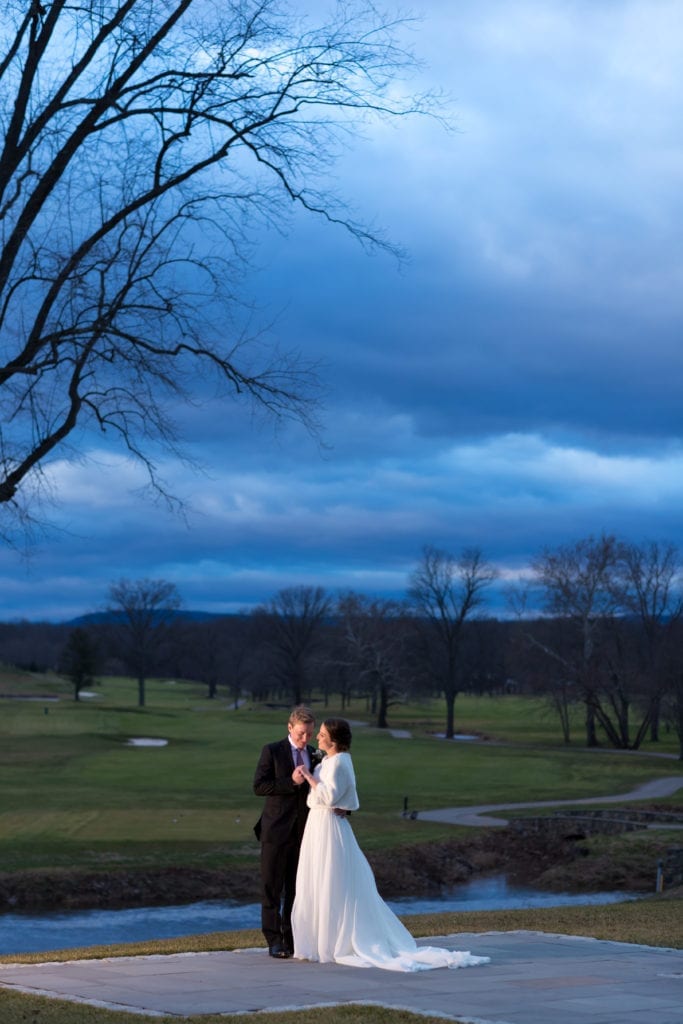 bride and groom at dusk on the golf course of fiddlers elbow country club