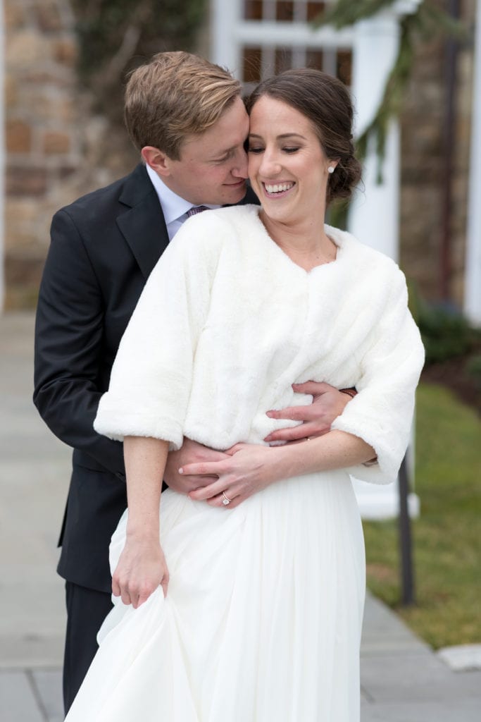 groom embracing his wife