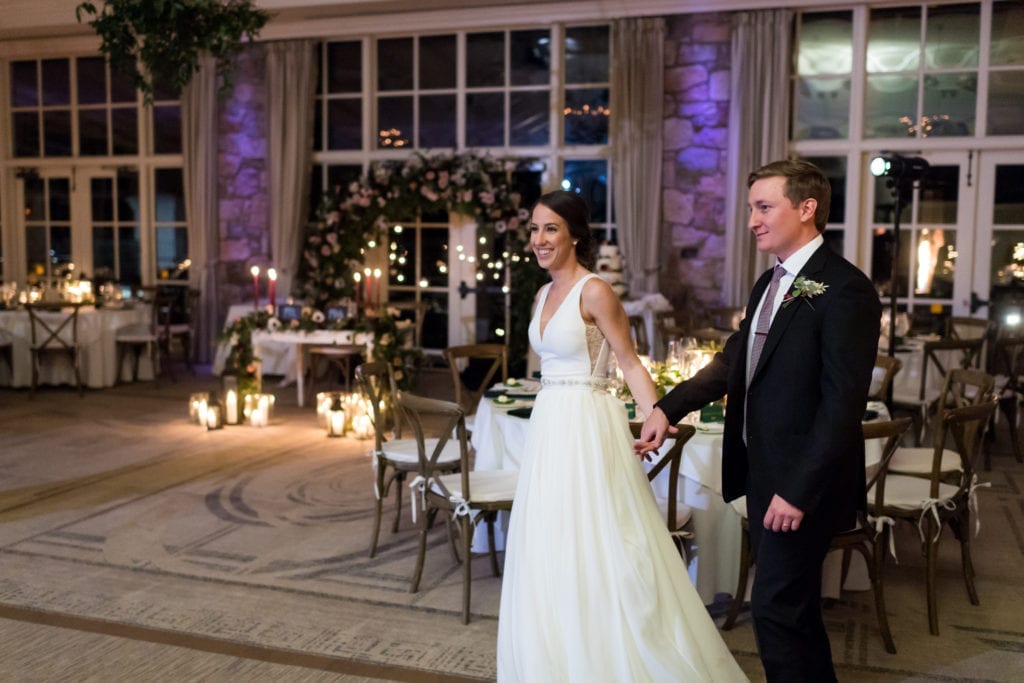 bride and groom entering their reception