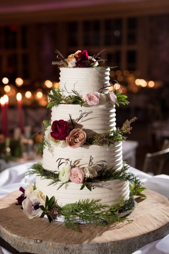 4 tiered wedding cake with florals