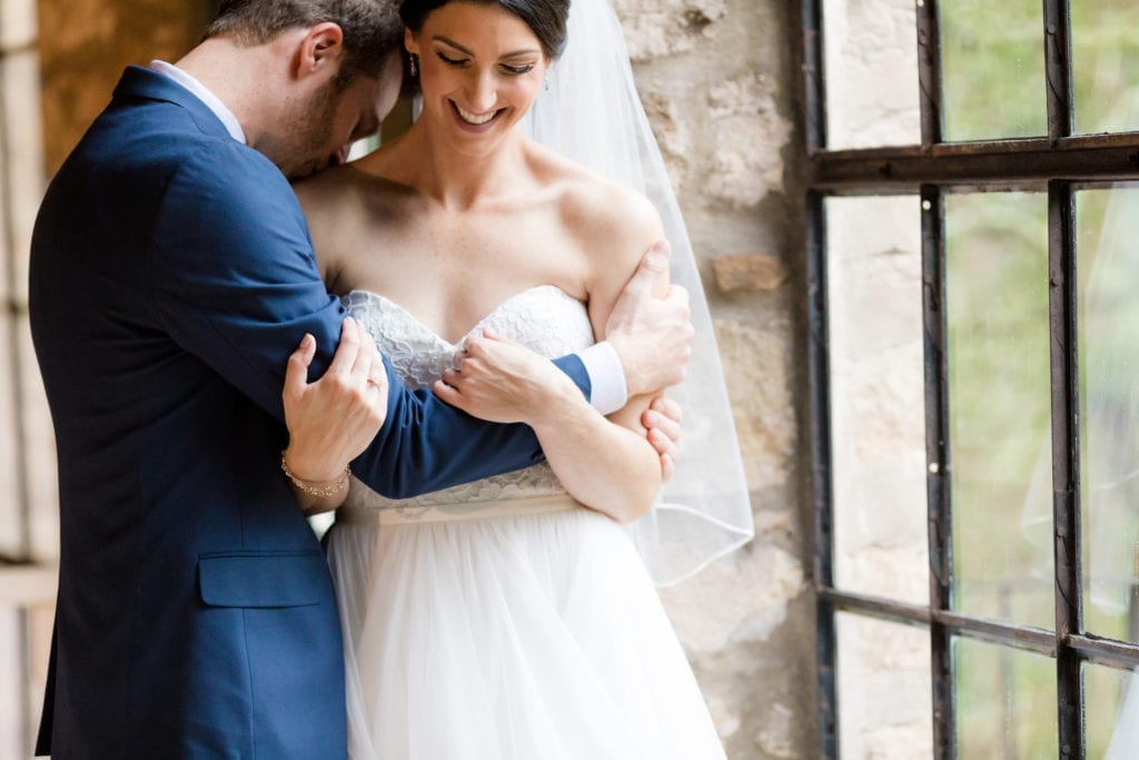 couple sharing a laugh before their wedding