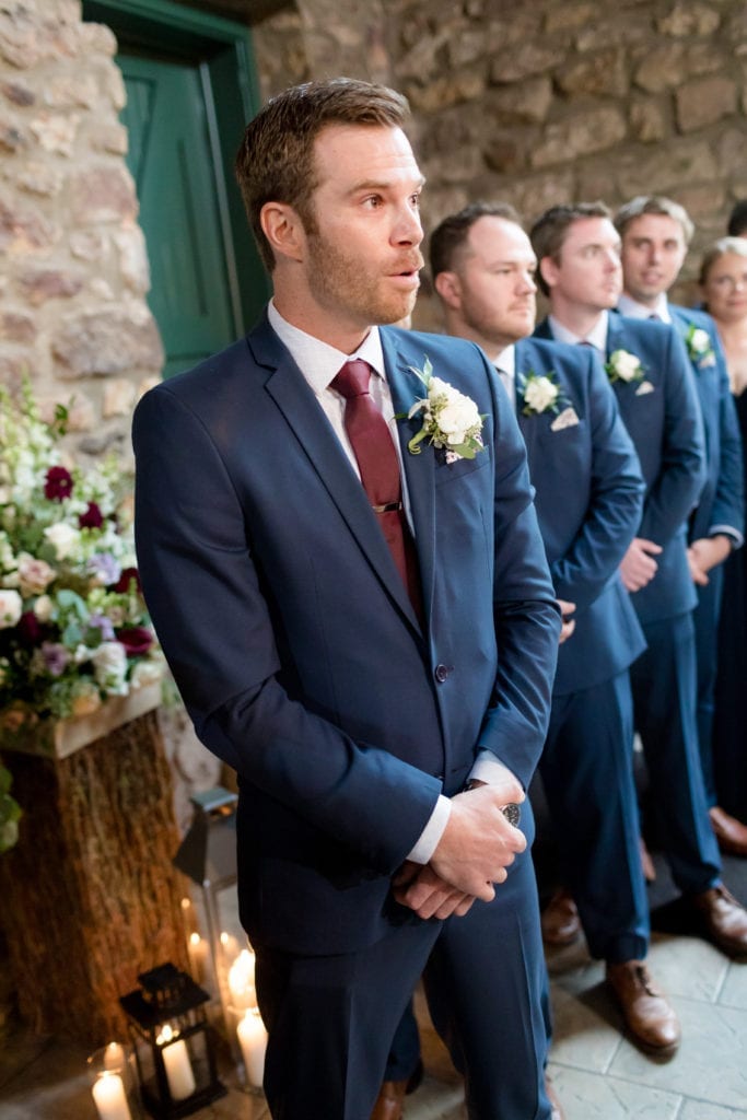 groom awaiting his brides arrival to the ceremony