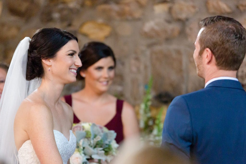 bride and groom at their wedding ceremony smiling