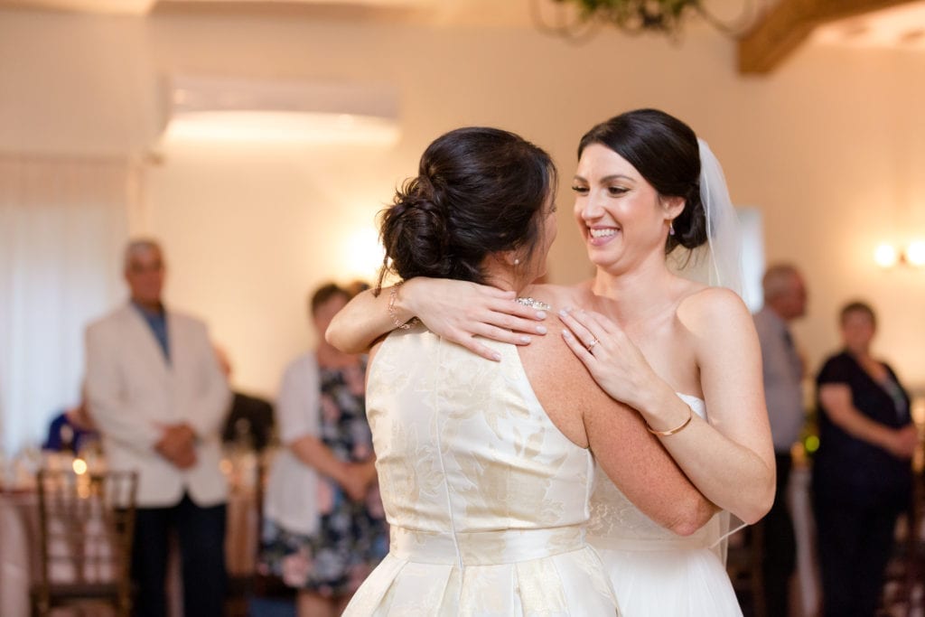 bride embracing her mother