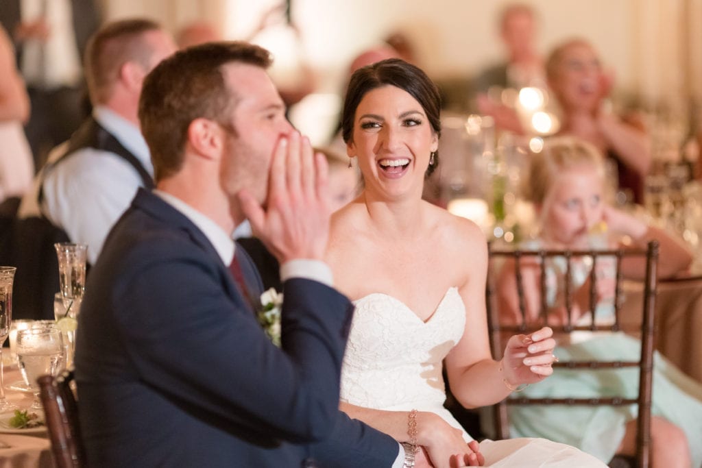 groom listening to wedding speeches