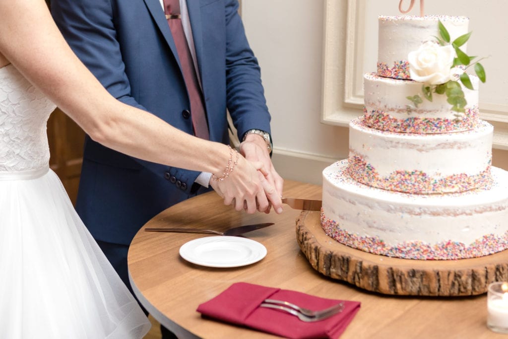 bride and groom cutting cake