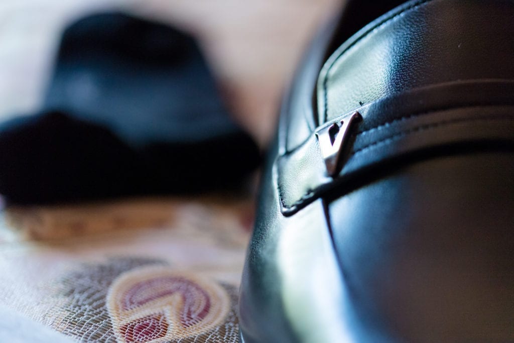 detail up close shot of grooms wedding shoes