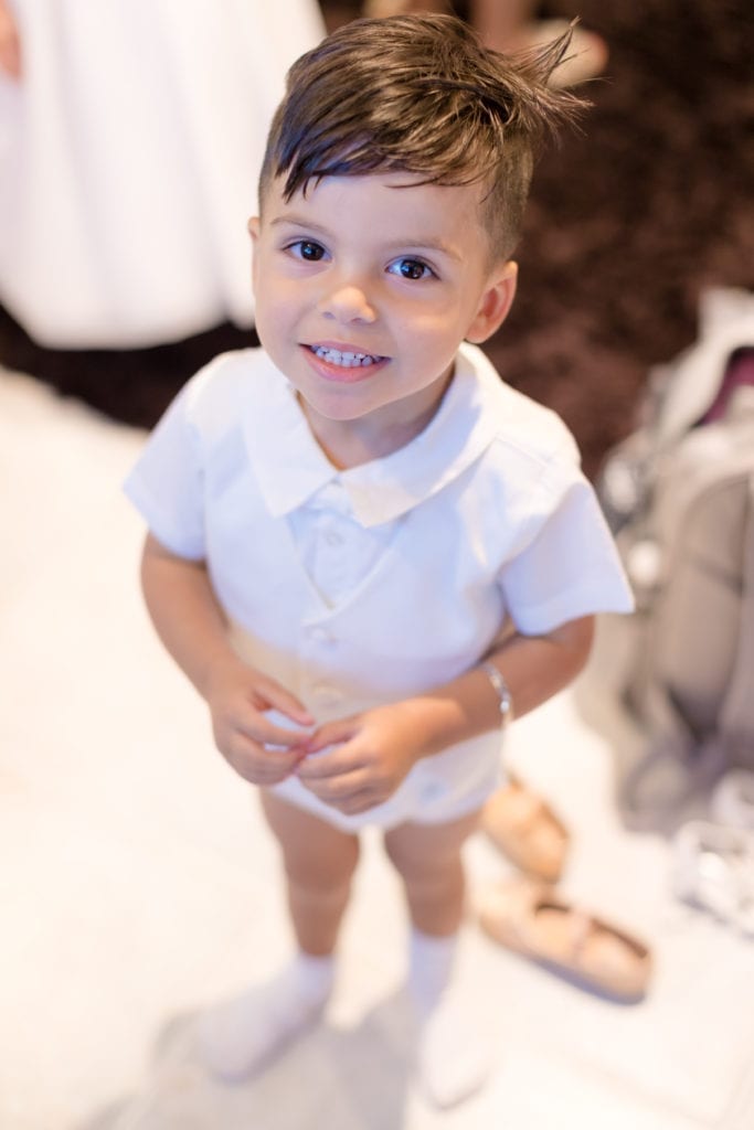 ring bearer smiling for the camera