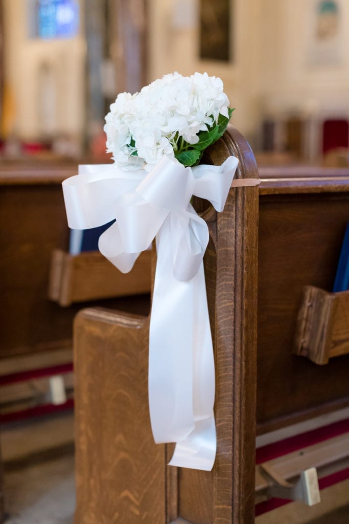 Pew flowers at wedding ceremony flowers by emil