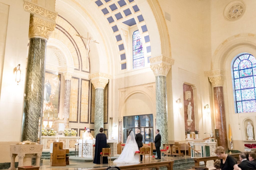 bride and groom listening to officiant at their wedding ceremony