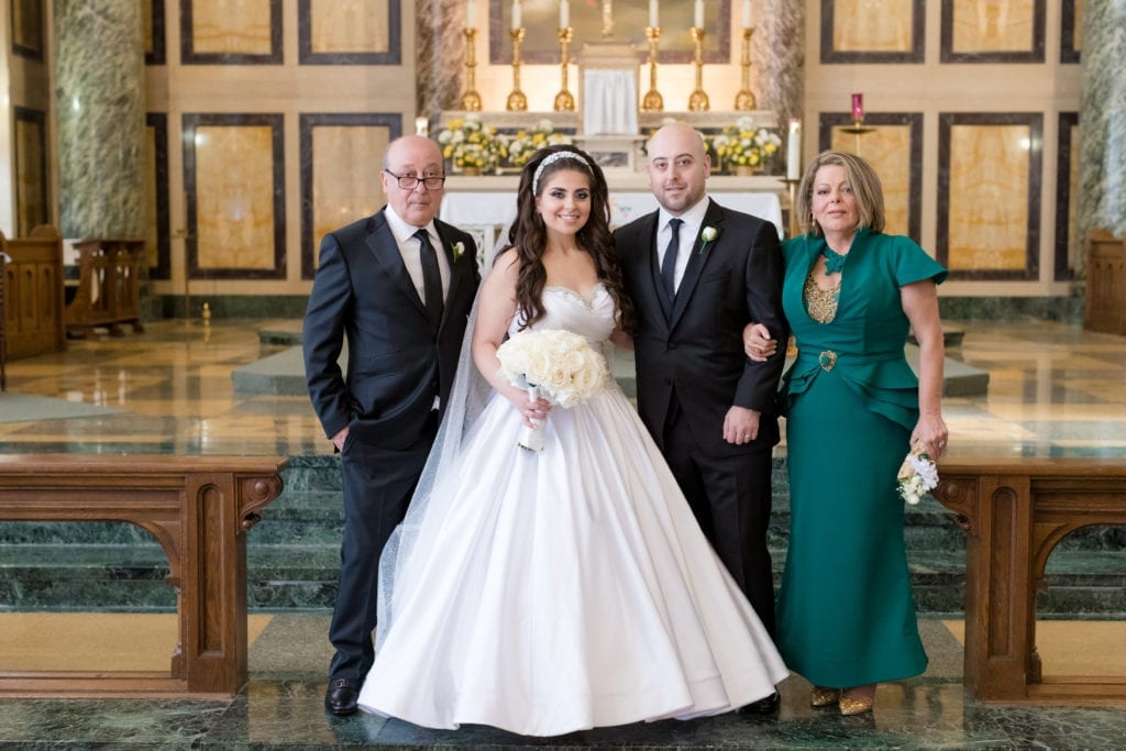 bride and groom with the groom's family