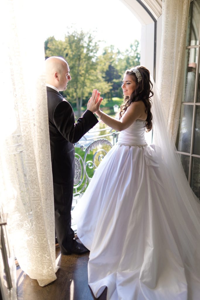 bride and groom high fiving