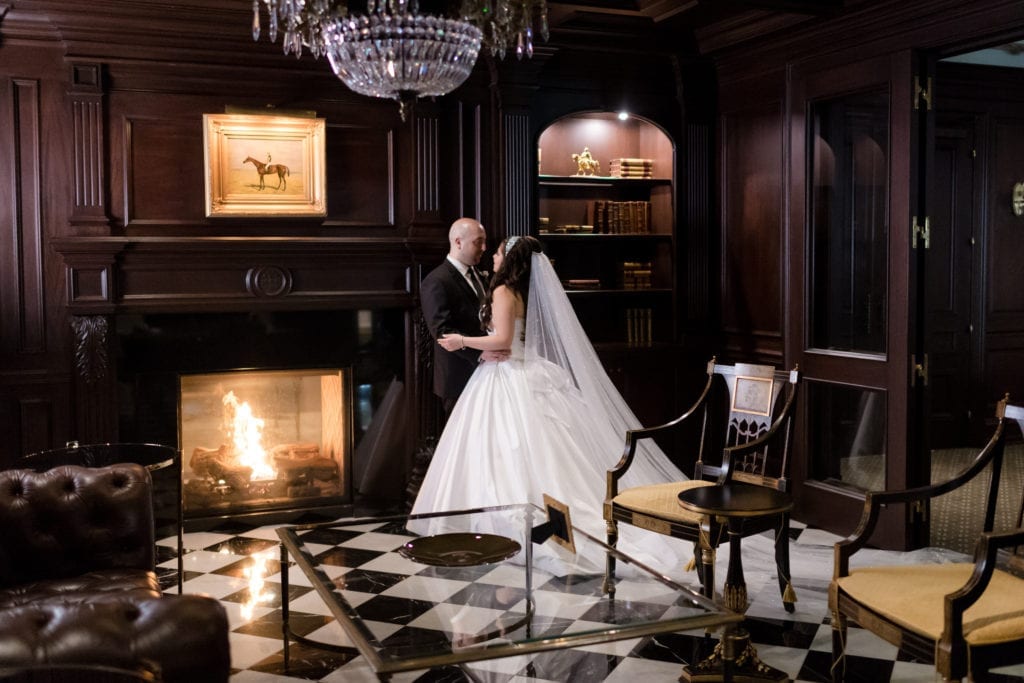 bride and groom at Park Chateau by the fireplace