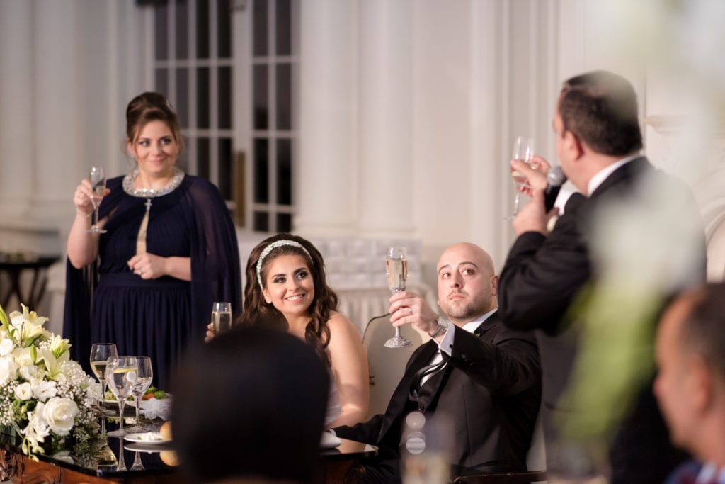 best man toasting to the bride and groom