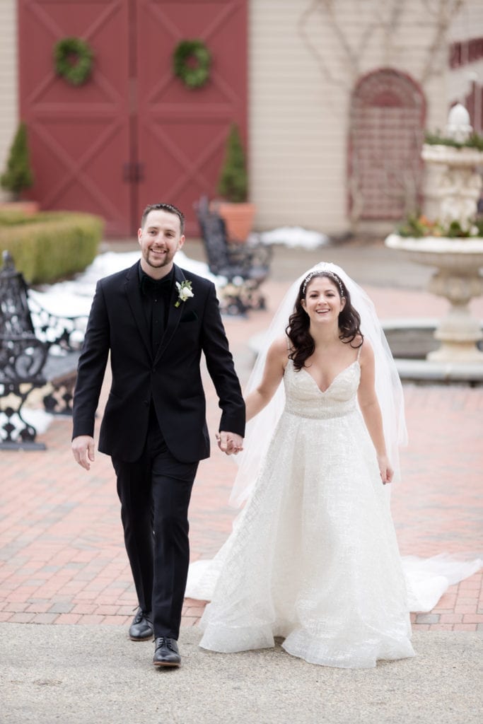 bride and groom walking into their ceremony