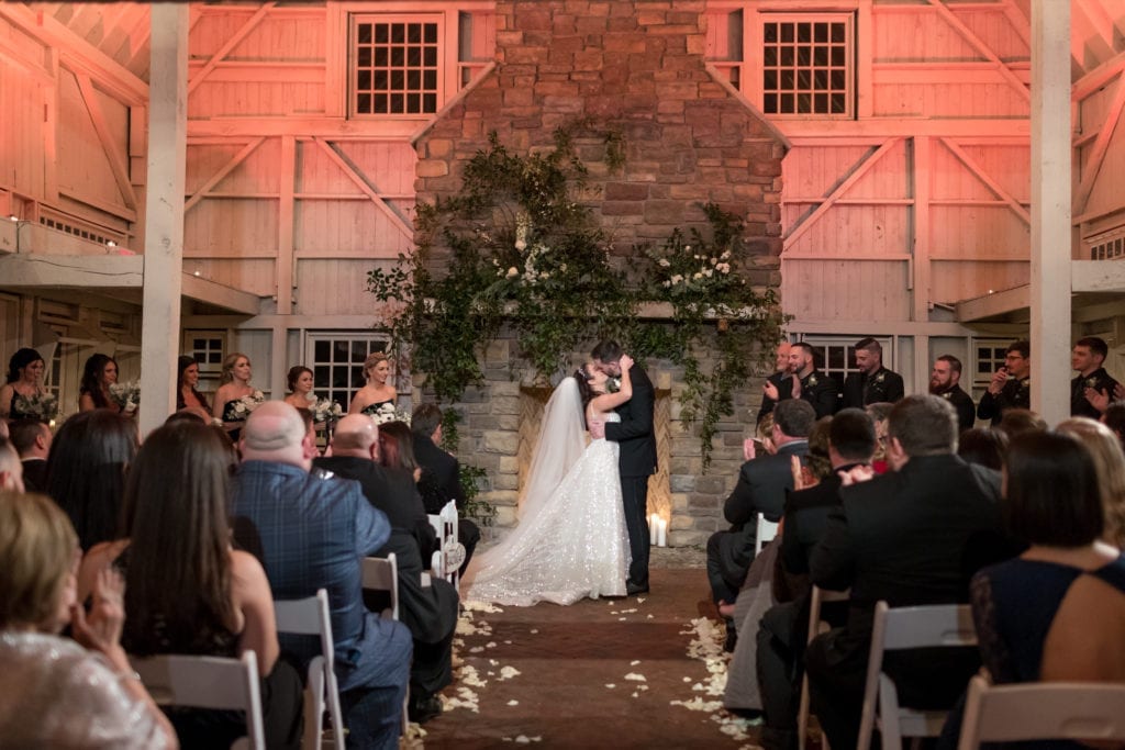 bride and grooms first kiss