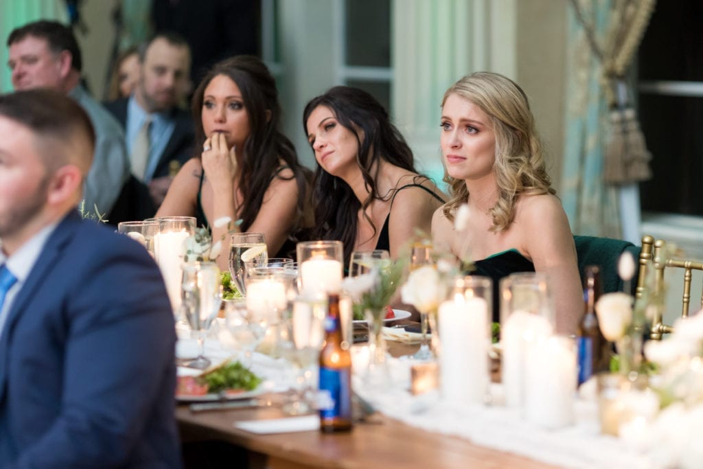 bridal party listening to speeches