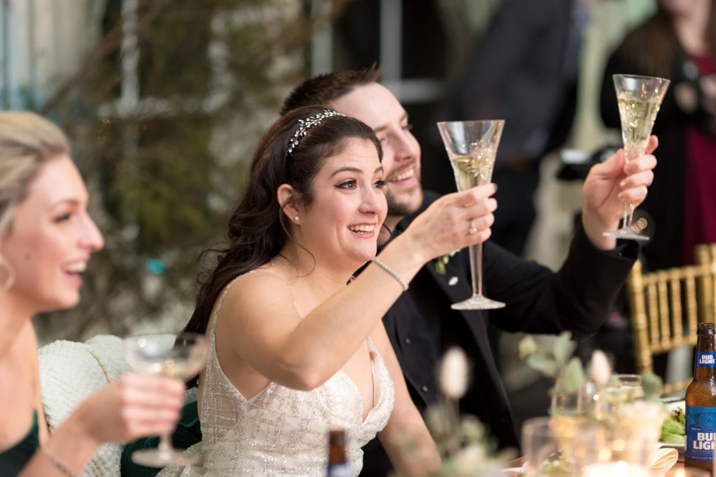 bride and groom toasting 