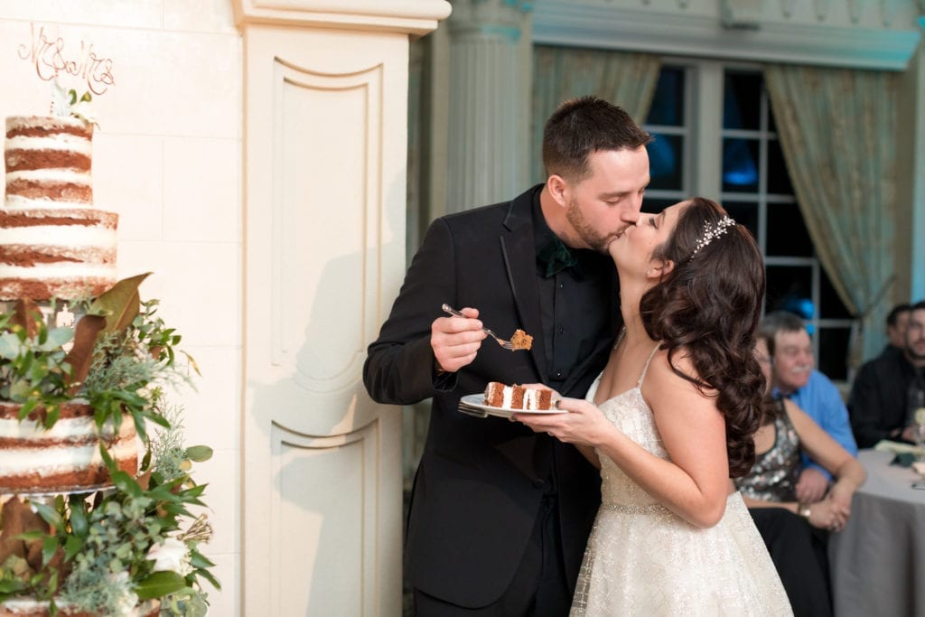 bride and groom cutting cake