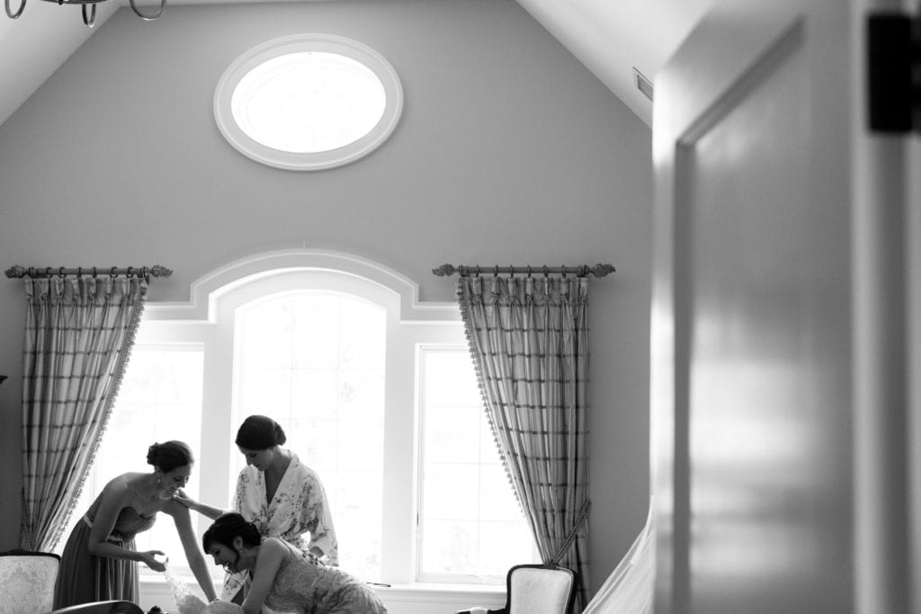 bride getting dressed with her bridesmaids, new jersey wedding photographer