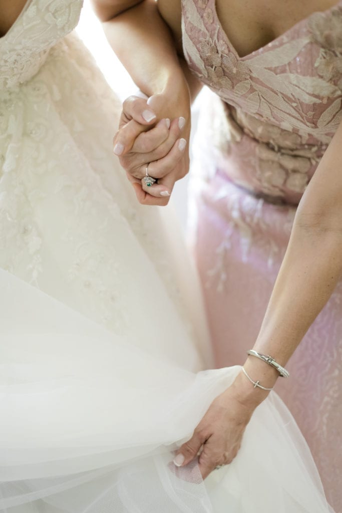 mother of the bride helping bride get ready, bridal preparations 