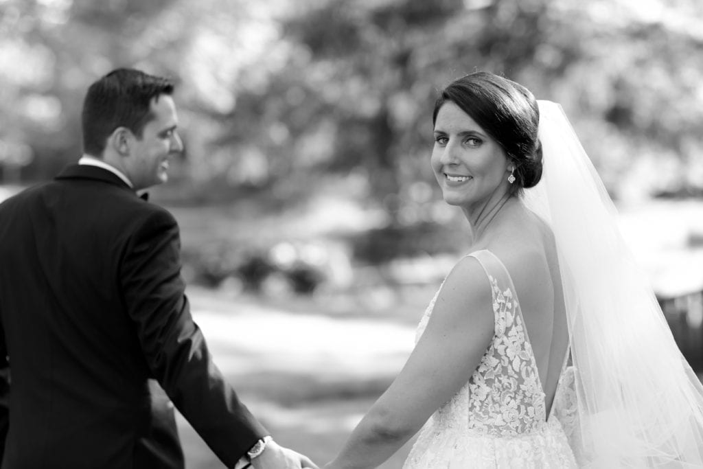 groom leading bride on their wedding day, Vanessa Joy Photography