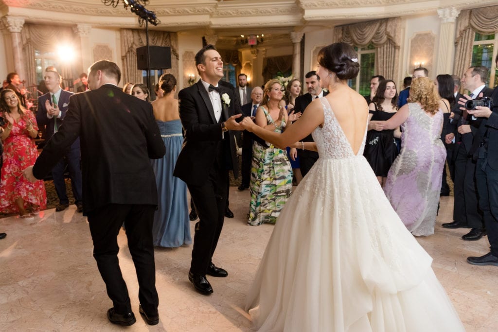 Pleasantdale chateau wedding reception, bride and groom having fun