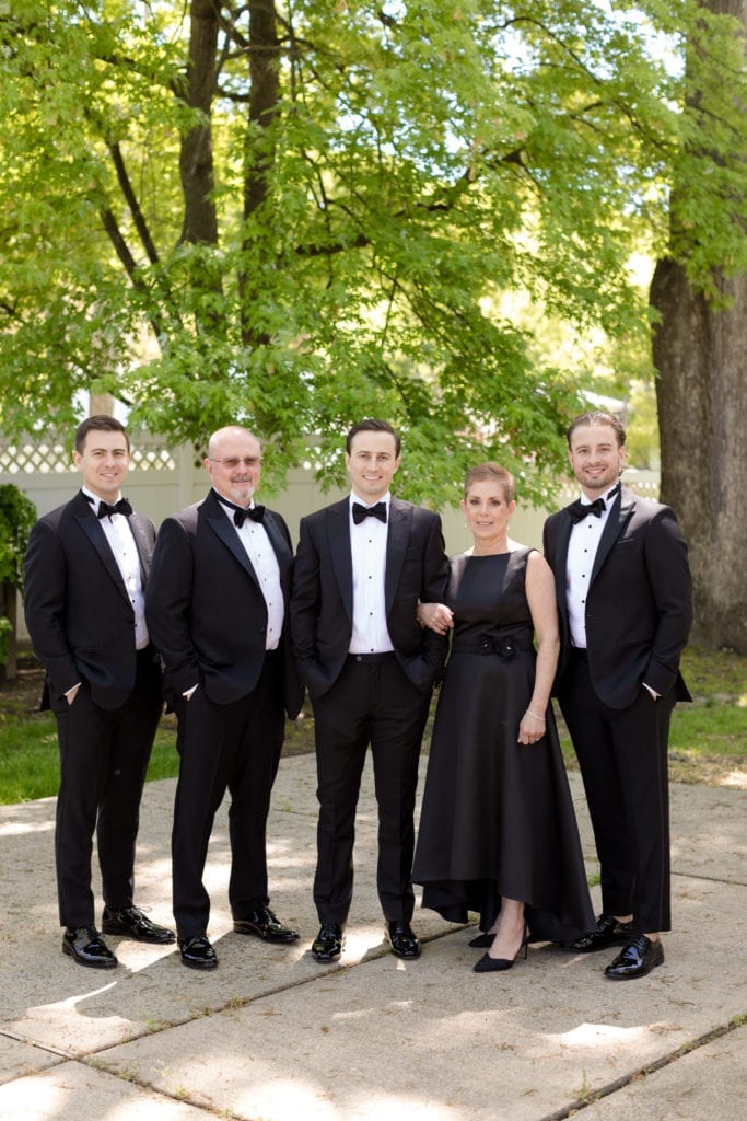 groom with his family, groom with parents and brothers