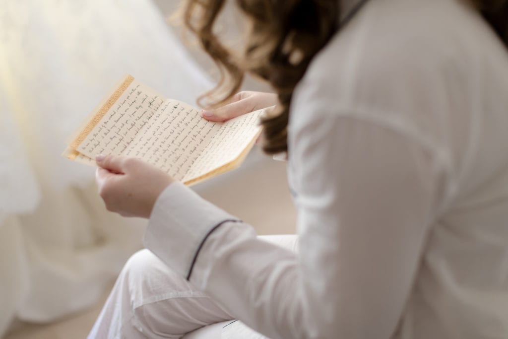 bride reading the letter from her groom