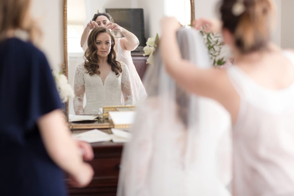 bride getting her veil put on