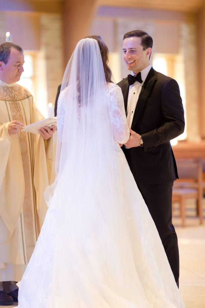 bride and groom at alter, bride and grooms Catholic wedding ceremony