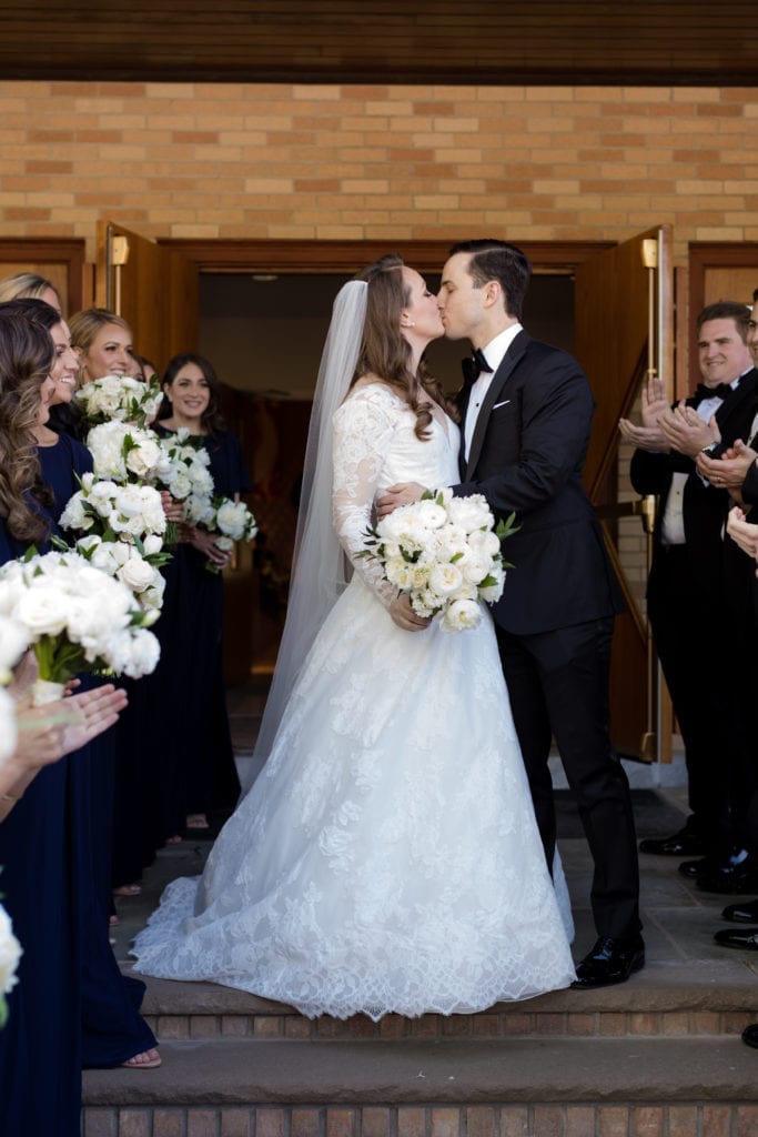 bride and grooms first kiss