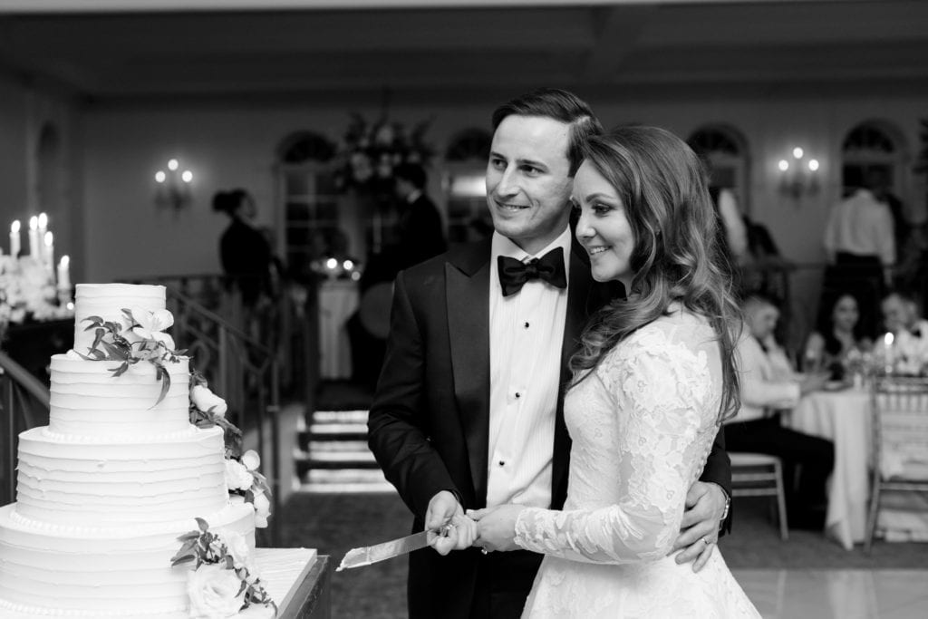 bride and groom cutting the cake