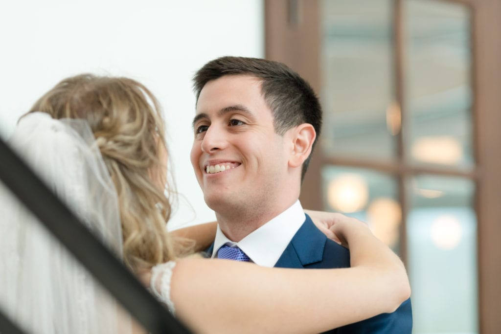 groom adoring his bride, first look