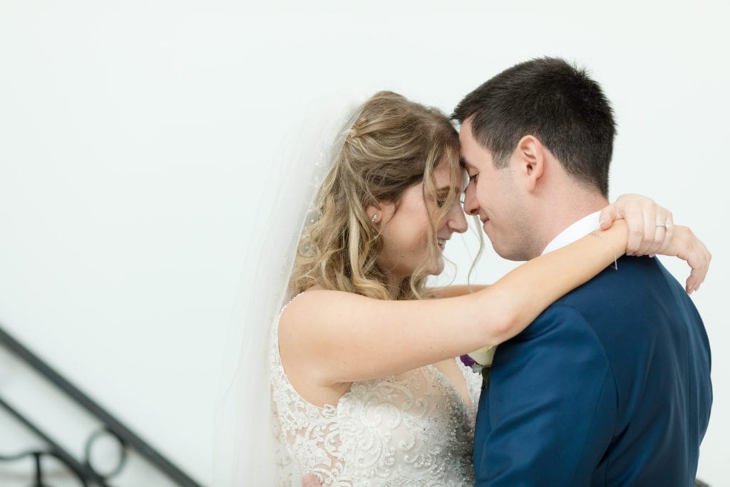 sweet embrace with bride and groom