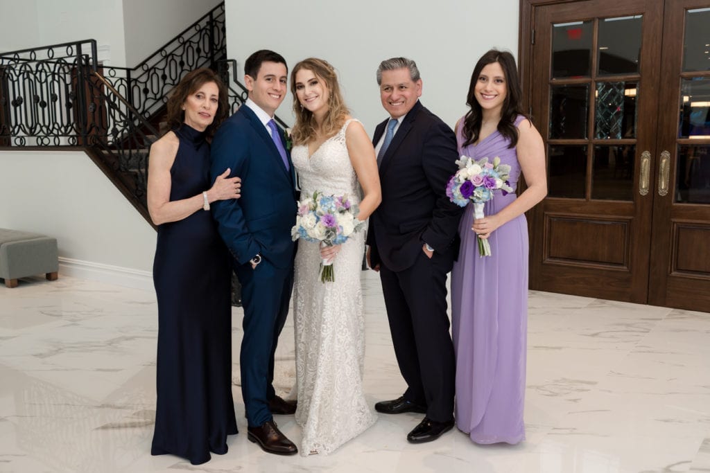 bride and groom with grooms family