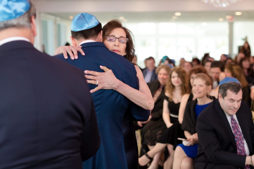 mother hugging her son the groom at alter, PA wedding photography